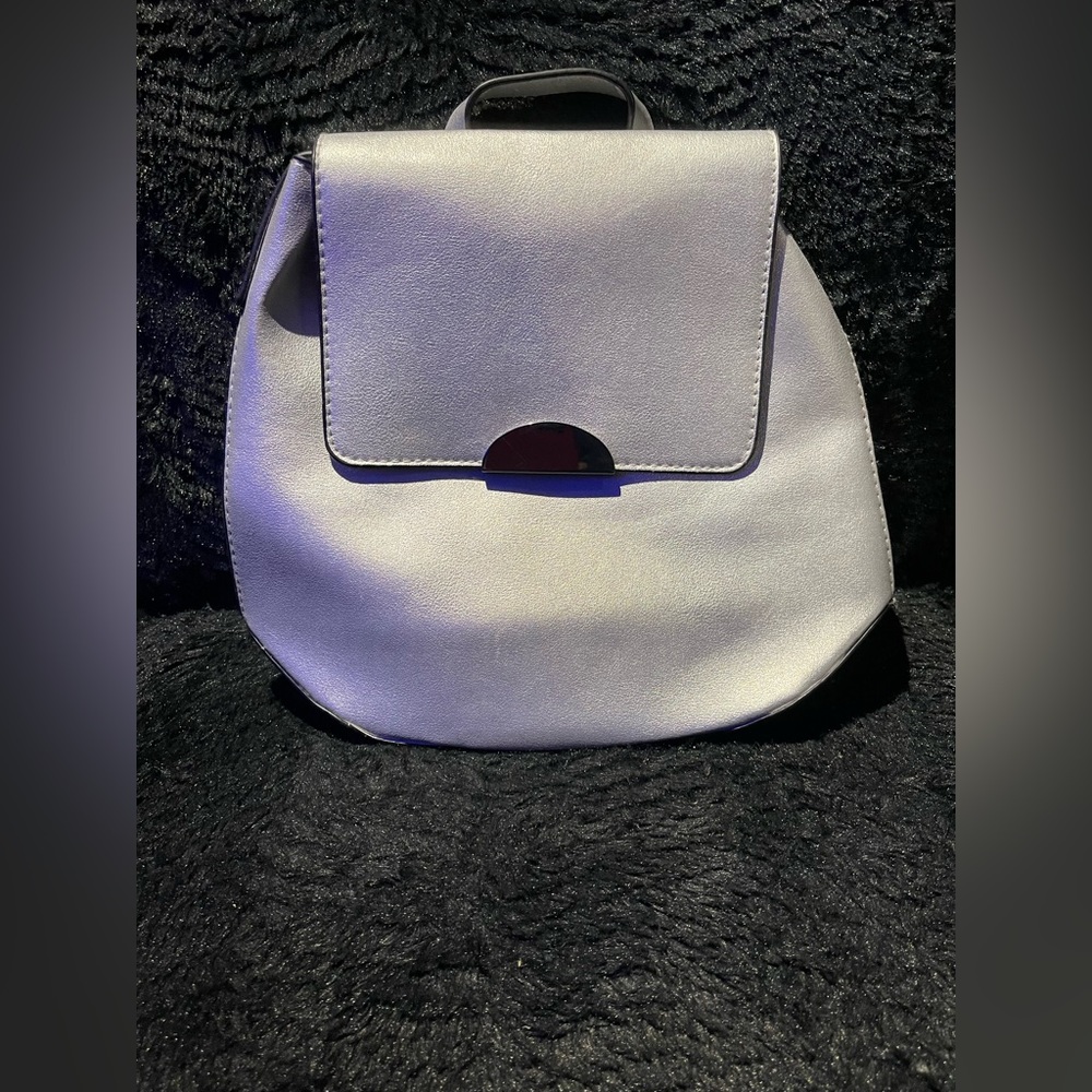 Silver Manmade leather backpack.